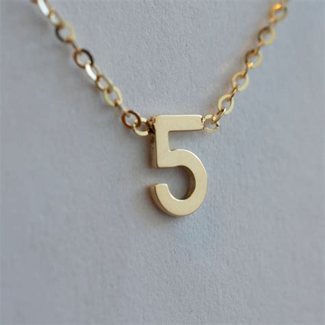 necklace with number 5.